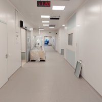 Коридор з білими стінами та годинником на стіні